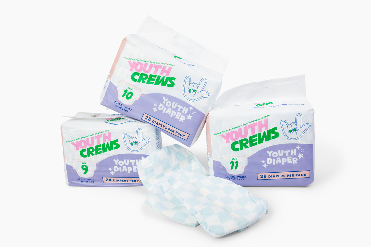 Packaging and diapers for 'YOUTH CREWS' displayed on a white background, featuring cartoon characters and blue patterns on the diapers.